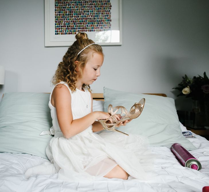 Flower Girl Looking at Jimmy Choo Shoes