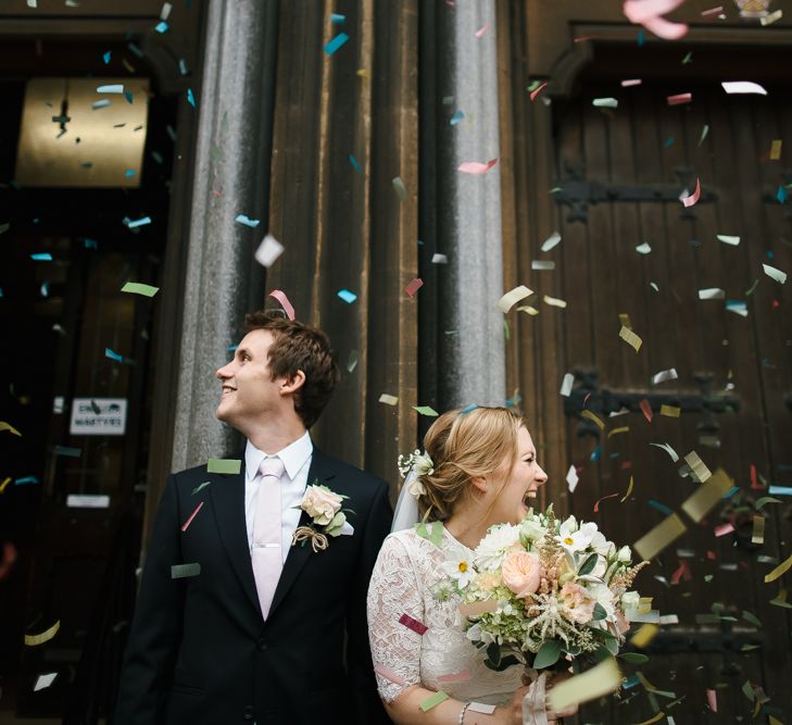 Confetti with Bride in Catherine Deane Separates & Groom in Black Suit