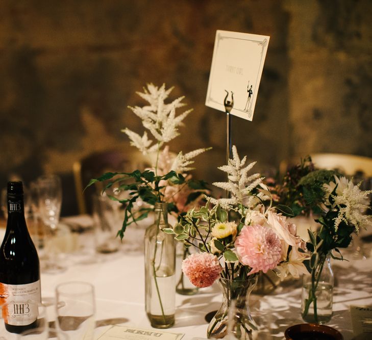 Flower Stems in Glass Bottles