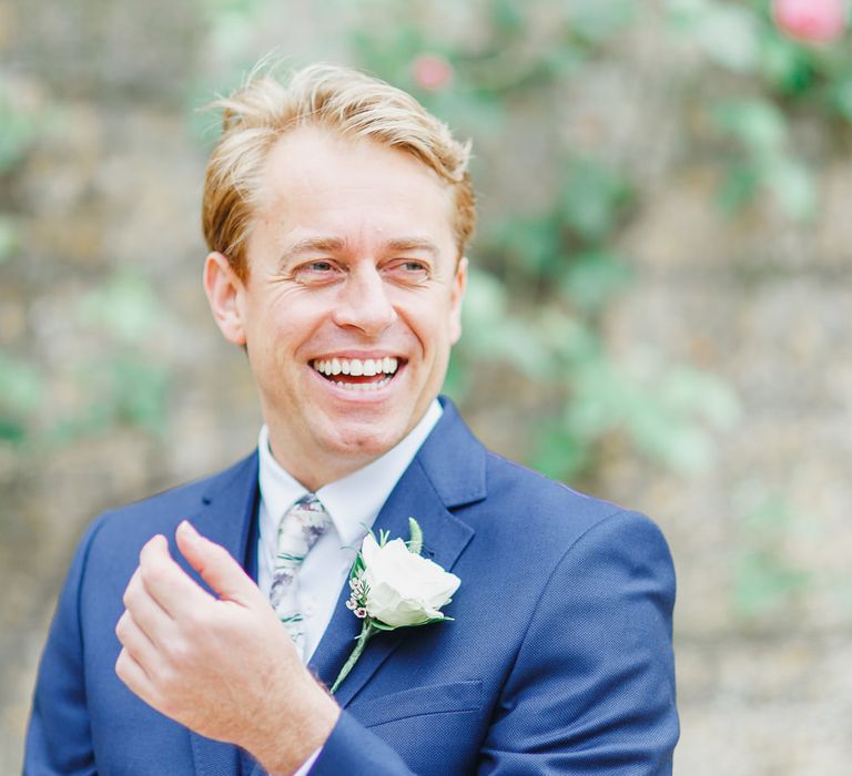 Groom in Ted Baker Navy Suit