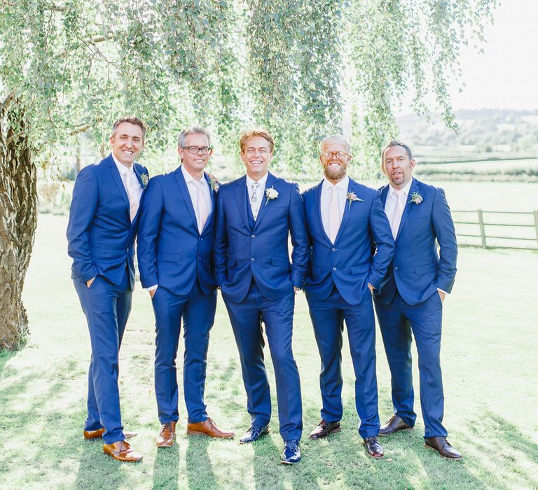 Groom in Ted Bake rNavy Suit & Groomsmen in Red Herring Suits from Debenhams