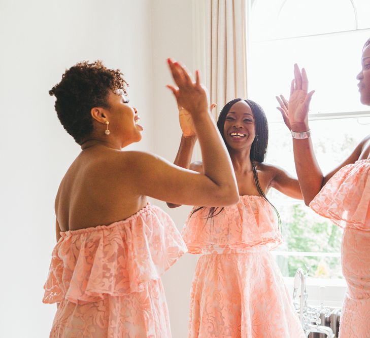 Bridesmaids In Pink Ruffled Dresses