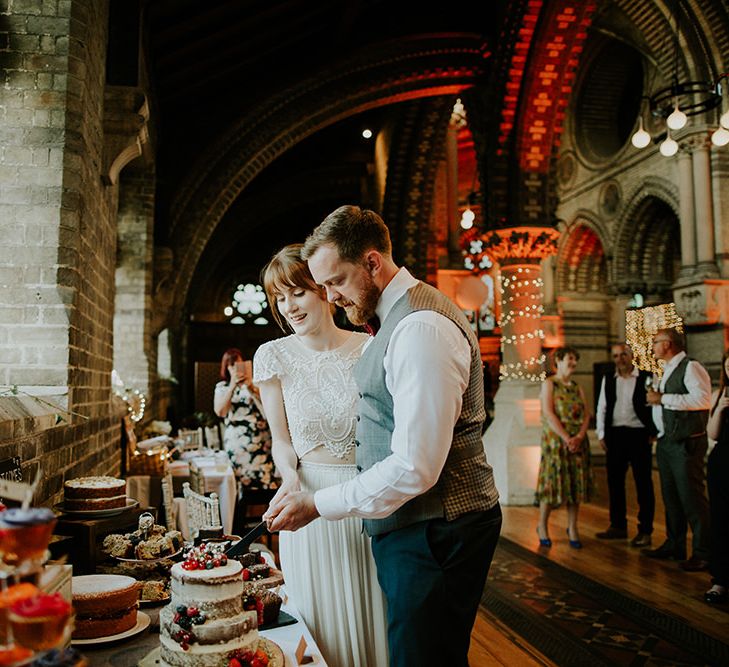 Cutting the Cake | Bride in Inbal Raviv Gown | Groom in Hugo Boss Suit | Luxe Wedding at St Stephen's Trust, Deconsecrated Church in Hampstead, London | Irene yap Photography