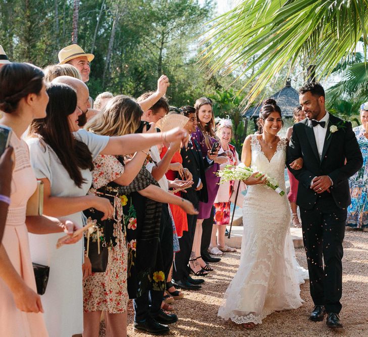 Confetti Moment | Bride in Lace Martina Liana Essense Design Wedding Dress | Groom in Paul Smith Suit | Ibiza Destination Wedding | Helen Abraham Photography | Ibiza Wedding Films