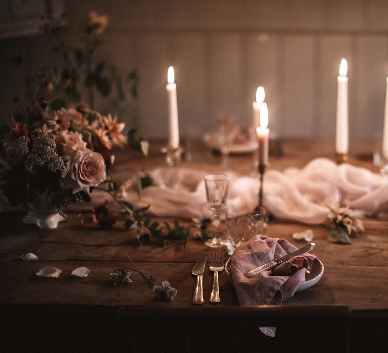 Short Cream Candles by Nordic House // Tall White Candles by Charles Farris // Vintage Glass & Copper Candlestick Holders to hire by Beatnik Bride // Silk Table Runner by Pompom Blossom // Linen Napkins & Plates by H&M Home // All vintage glassware and cutlery to hire by Beatnik Bride