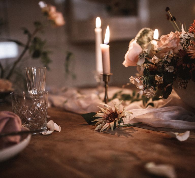 Short Cream Candles by Nordic House // Tall White Candles by Charles Farris // Vintage Glass & Copper Candlestick Holders to hire by Beatnik Bride // Silk Table Runner by Pompom Blossom // Linen Napkins & Plates by H&M Home // All vintage glassware and cutlery to hire by Beatnik Bride