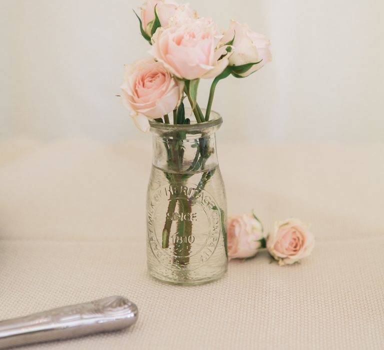 Pink Flower Stems in Milk Bottles