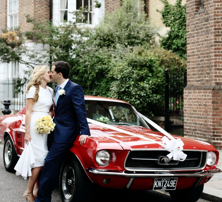 Red Mustang | Bride in Contemporary J Mendel Wedding Dress | Groom in Gieves & Hawkes Suit | Dasha Caffrey Photography