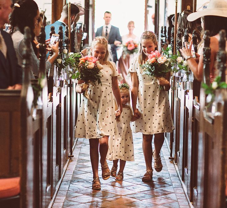 Bridesmaids In Copper Skirts With Cream Tops