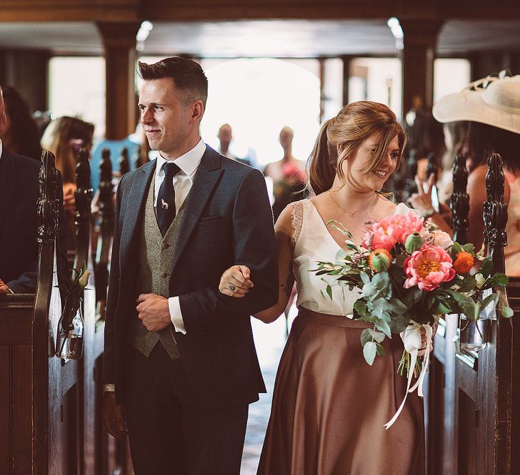 Bridesmaids In Copper Skirts With Cream Tops