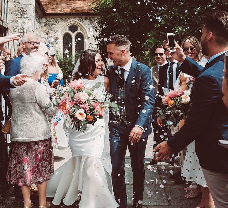 Confetti Shot Of Bride & Groom