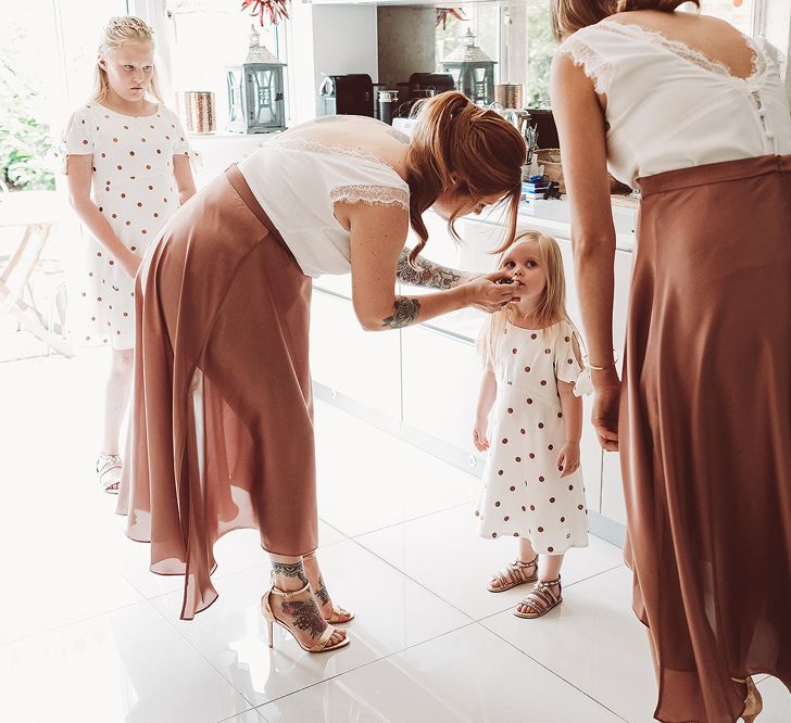 Bridesmaids In Copper Skirts With Cream Tops