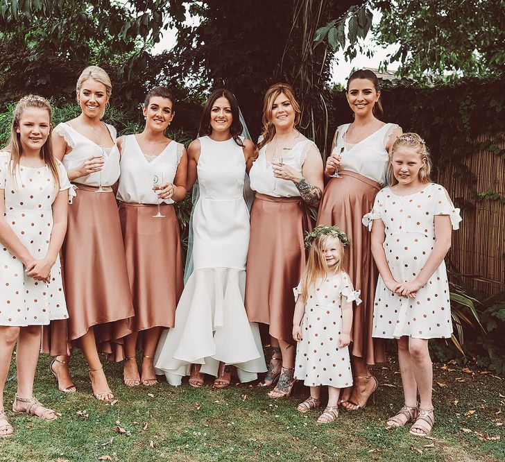 Bridesmaids In Copper Skirts With Cream Tops