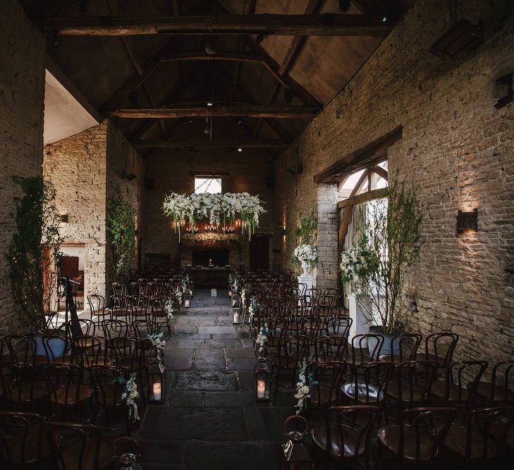 Cripps Barn Ceremony Room | Hanging Floral Display | Aisle Chair Decor | Andy Gaines Photography | Thompson Granger Films