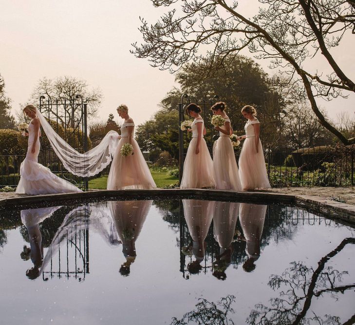 Bride in Christos Costarellos Fishtail Gown | Bridesmaids in Blush Tulle Skirt & White Top Separates | Andy Gaines Photography | Thompson Granger Films