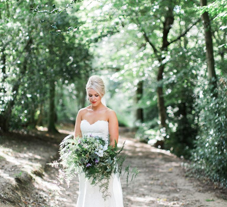 Bride with Foliage Filled Bouquet by Frog Manchester