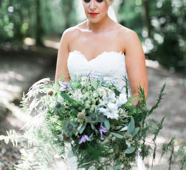 Bride with Foliage Filled Bouquet by Frog Manchester