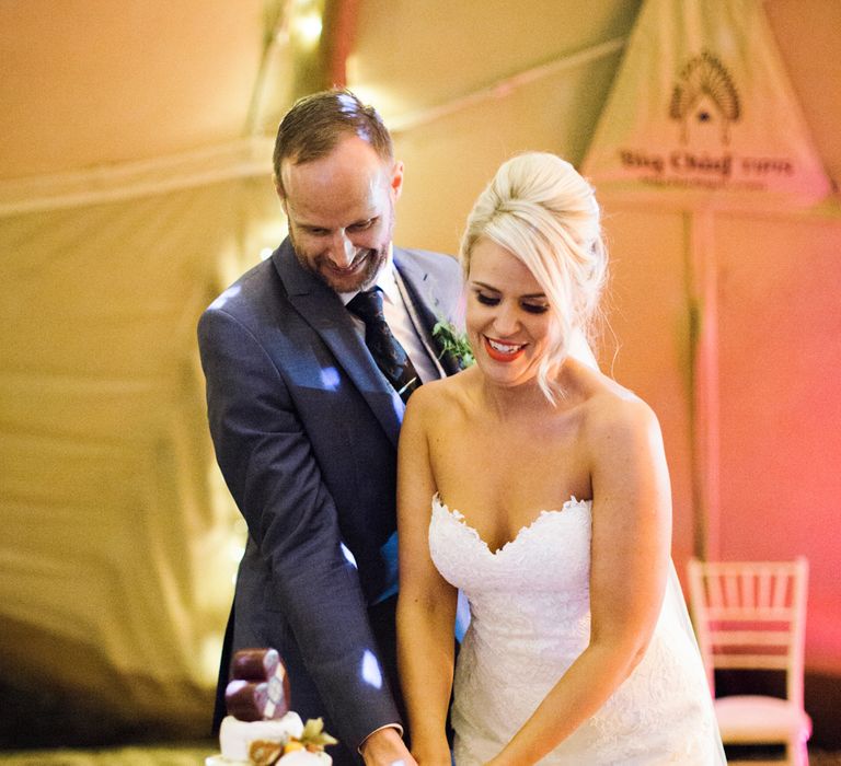 Bride and Groom Cutting Cake