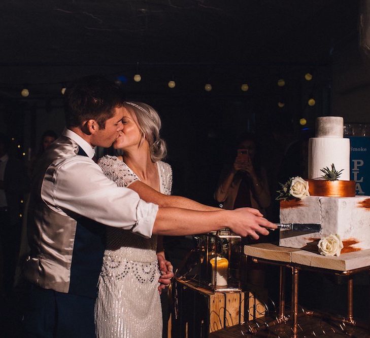 Bride & Groom Cutting The Cake