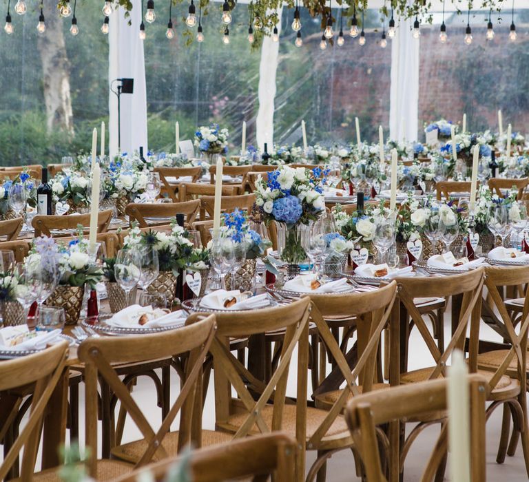 Botanical Marquee Reception with Hanging Greenery & Edison Light Installations | Lucy Davenport Photography