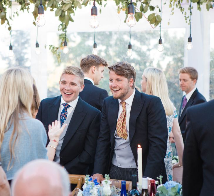 Botanical Marquee Reception with Hanging Greenery & Edison Light Installations | Lucy Davenport Photography