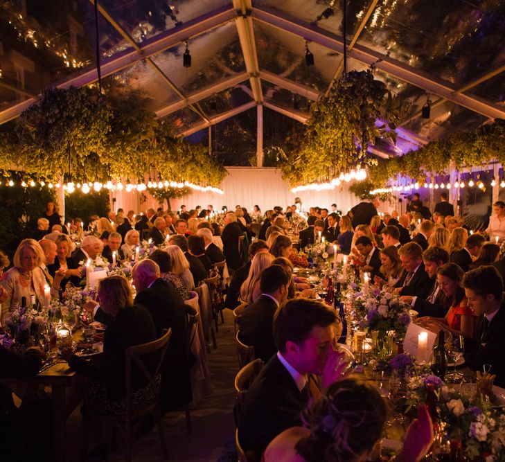 Botanical Marquee Reception with Hanging Greenery & Edison Light Installations | Lucy Davenport Photography