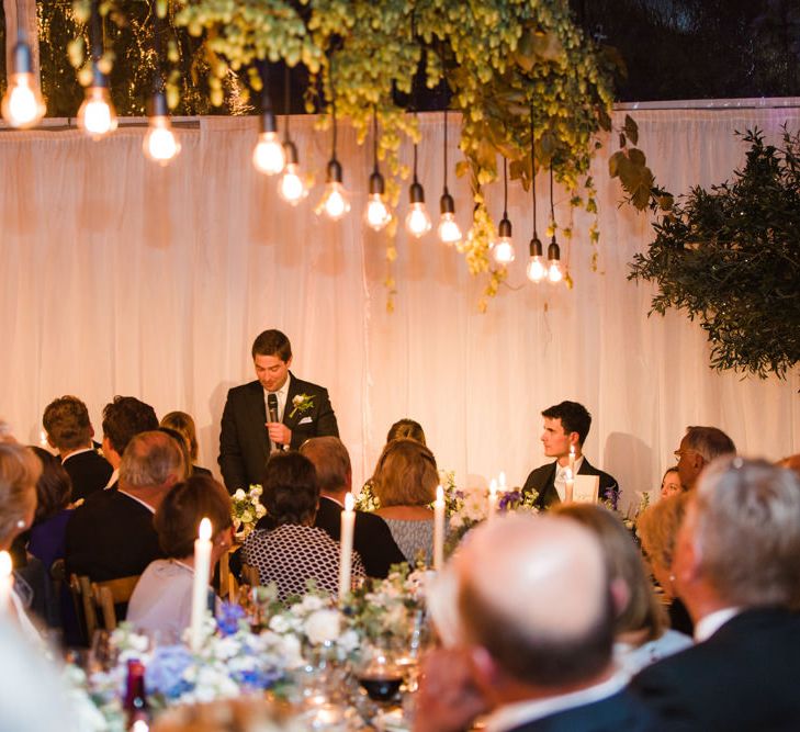 Botanical Marquee Reception with Hanging Greenery & Edison Light Installations | Lucy Davenport Photography