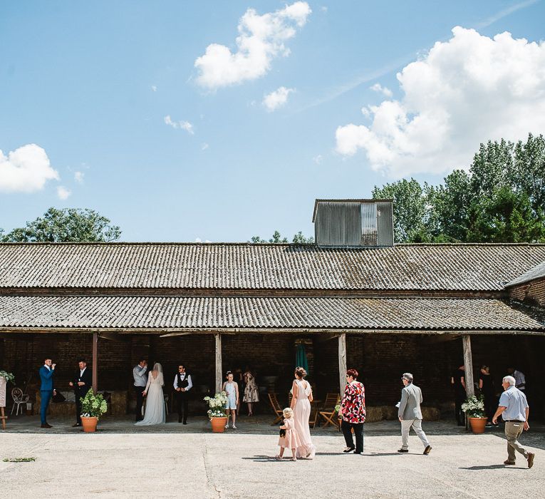 Fishley Hall Wedding With Rustic Details Lots Of Foliage & Festoon Lights With Krispy Kreme Donut Wedding Cake & Images By Luis Holden Photography