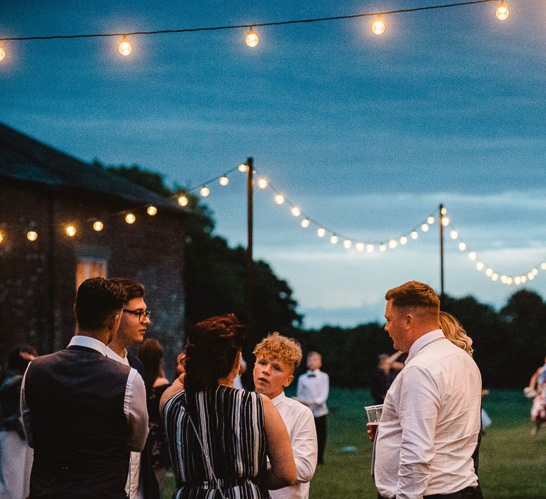 Fishley Hall Wedding With Rustic Details Lots Of Foliage & Festoon Lights With Krispy Kreme Donut Wedding Cake & Images By Luis Holden Photography