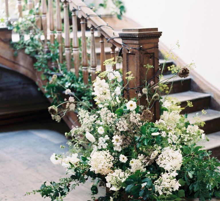 Floral Staircase Installation | Summer Styling Reimagined | Florals by <a href="https://www.thegardengateflowercompany.co.uk" rel="noopener" target="_blank”>The Garden Gate Flower Company </a> | Image by <a href="https://taylorandporter.co.uk/ " rel="noopener" target="_blank”>Taylor & Porter </a>