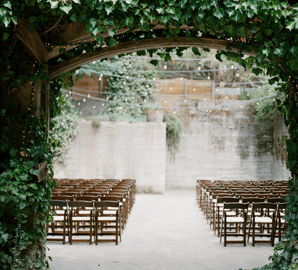 Festoon Lights Aisle | Summer Styling Reimagined | Image via <a href="https://www.oncewed.com" rel="noopener" target="_blank">Once Wed</a> | Image by <a href="https://austingros.com" rel="noopener" target="_blank">Austin Gros</a>