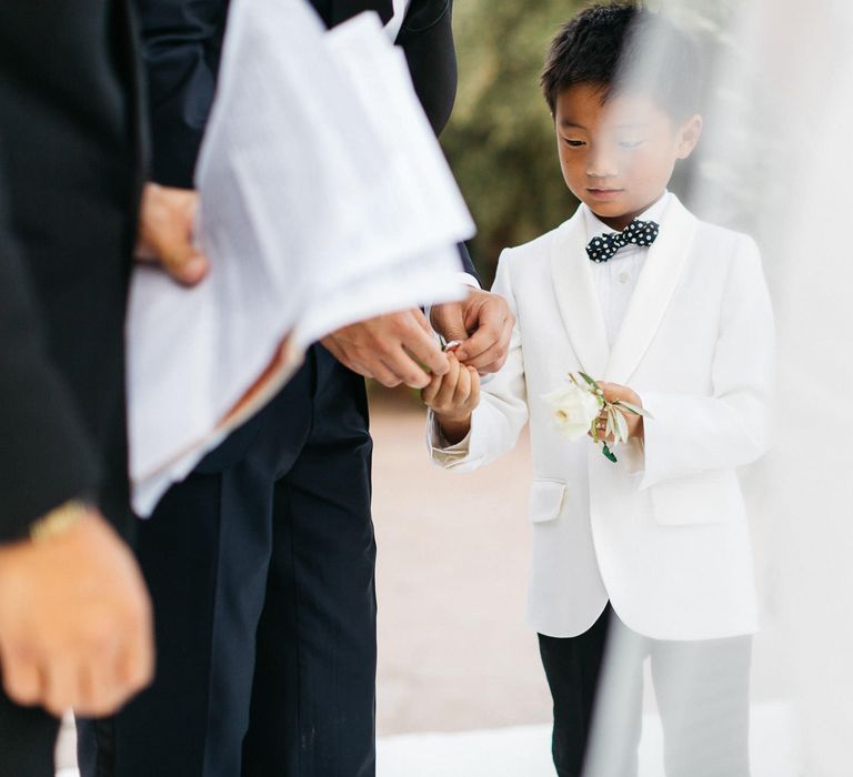 Page Boy In White Jacket With Black Bowtie