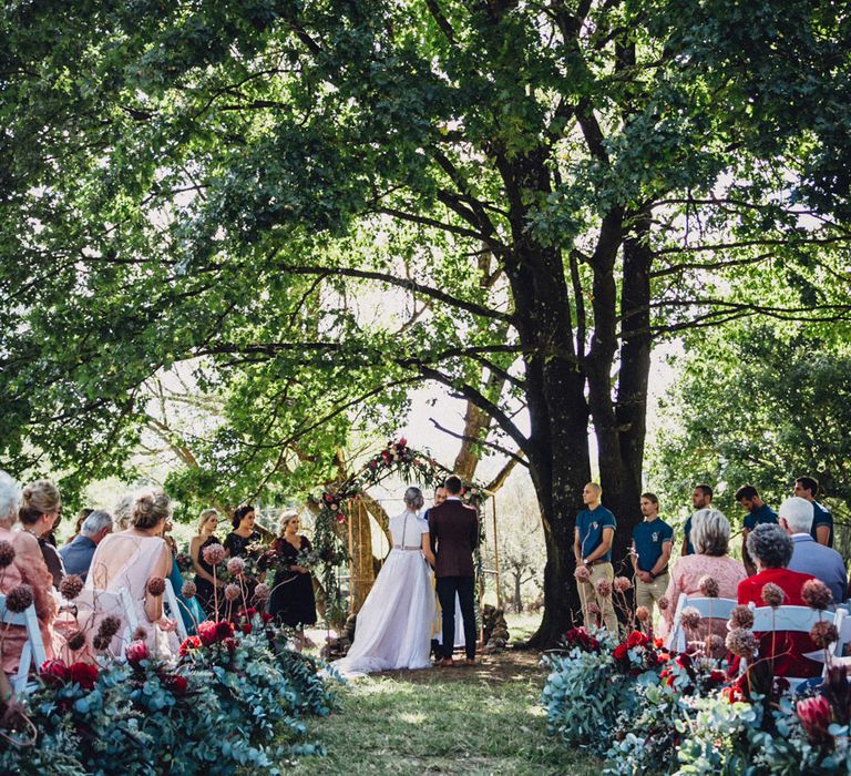 Outdoor Alternative Wedding at Nonnins Family Farm | Bride in Purple Terrence Bray Wedding Dress | Groom in Burgundy Suit | Andy & Szerdi Photography | Forman Wedding Films