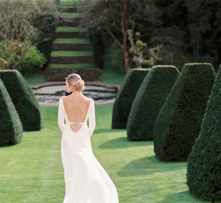 Backless Wedding Dress | Elegant Wedding Inspiration at Cornwell Manor with Floral Design by Bramble and Wild | Bowtie & Belle Photography | Carmencita Film Lab | Baxter and Ted Films