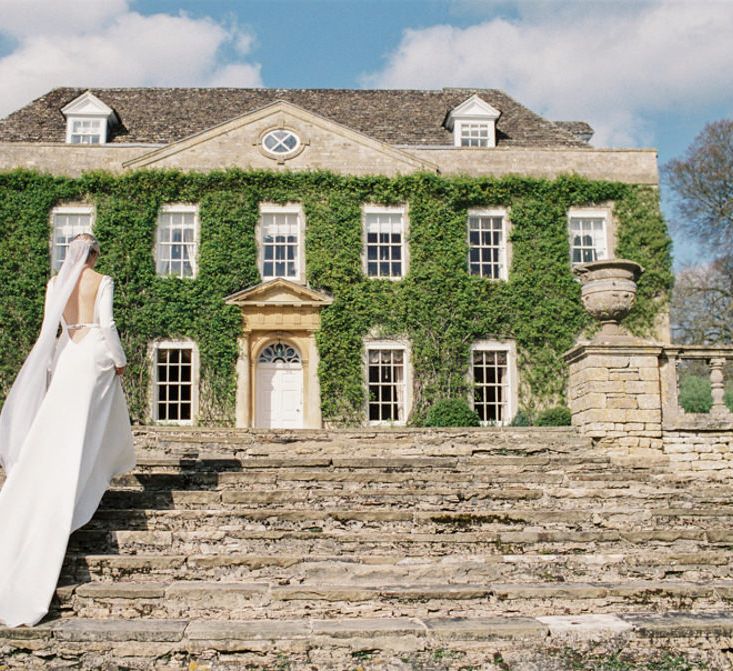 Backless Wedding Dress | Elegant Wedding Inspiration at Cornwell Manor with Floral Design by Bramble and Wild | Bowtie & Belle Photography | Carmencita Film Lab | Baxter and Ted Films