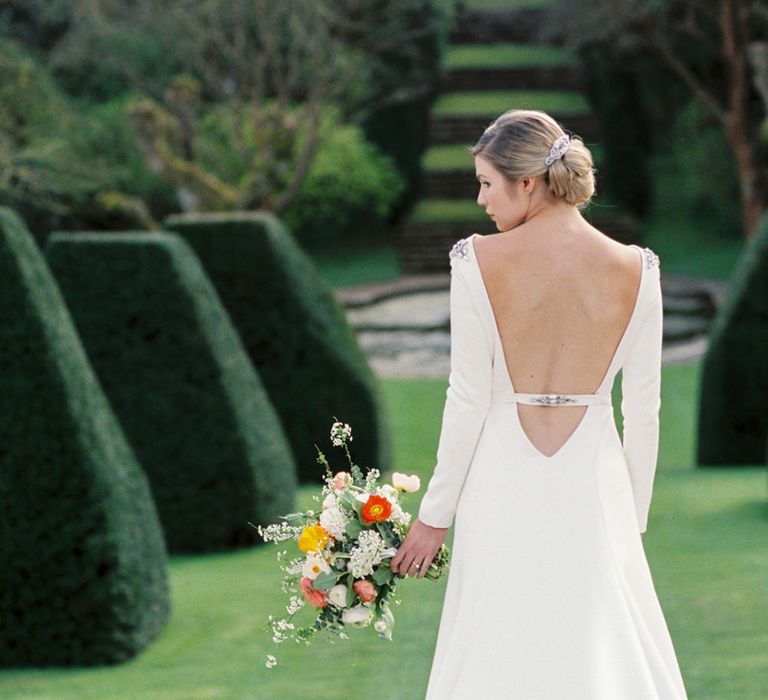 Backless Wedding Dress | Elegant Wedding Inspiration at Cornwell Manor with Floral Design by Bramble and Wild | Bowtie & Belle Photography | Carmencita Film Lab | Baxter and Ted Films