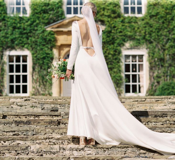 Backless Wedding Dress | Elegant Wedding Inspiration at Cornwell Manor with Floral Design by Bramble and Wild | Bowtie & Belle Photography | Carmencita Film Lab | Baxter and Ted Films