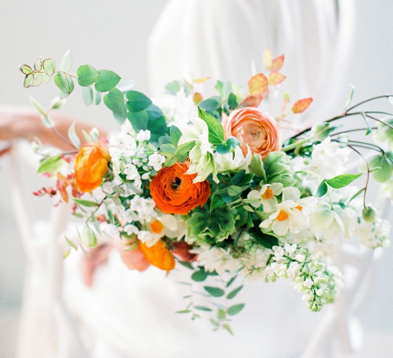 Orange chair Back Flowers | Elegant Wedding Inspiration at Cornwell Manor with Floral Design by Bramble and Wild | Bowtie & Belle Photography | Carmencita Film Lab | Baxter and Ted Films