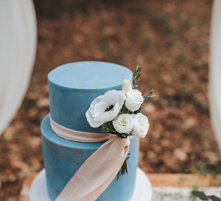 Blue Wedding Cake With Pink Ribbon