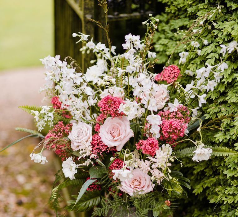 Milk Churn Floral Arrangement | Outdoor Ceremony & Rustic Barn Reception at Pennard House Somerset | John Barwood Photography