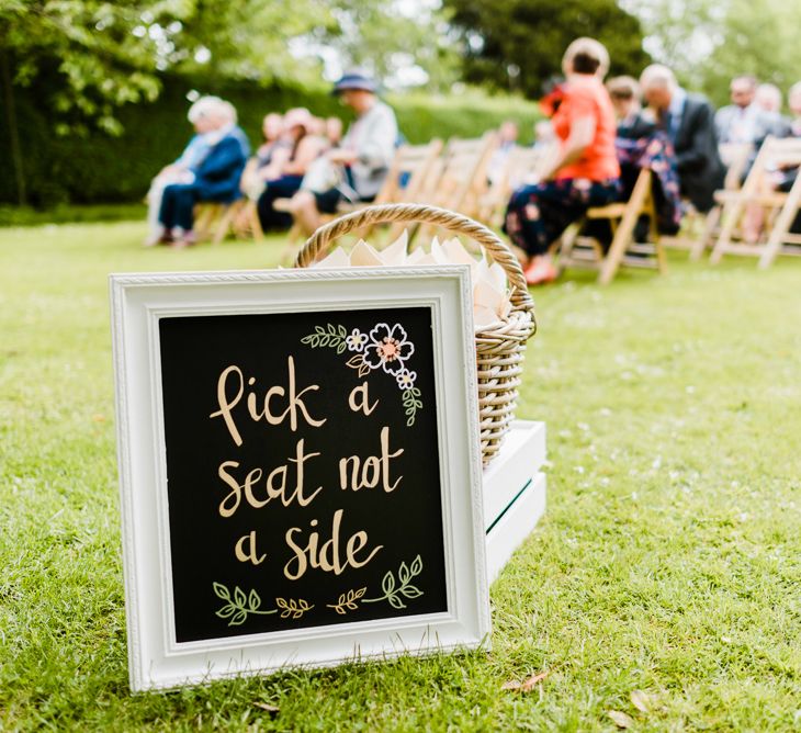 Pick a Seat Not a Side Ceremony Sign | Outdoor Ceremony & Rustic Barn Reception at Pennard House Somerset | John Barwood Photography