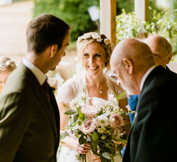 Wedding Ceremony | Bride in Jenny Packham Gown | Groom in Hugo Morris Tweed Suit | Outdoor Ceremony & Rustic Barn Reception at Pennard House Somerset | John Barwood Photography