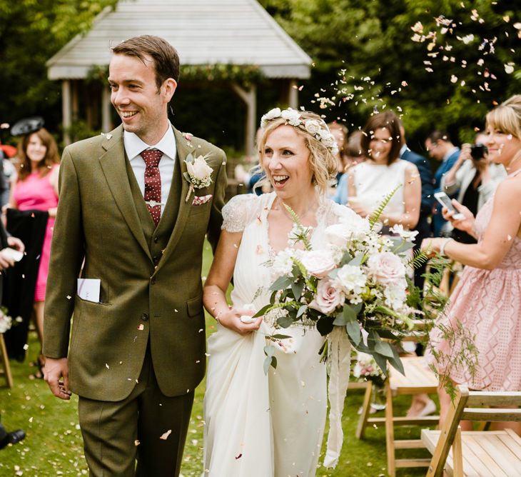 Wedding Ceremony | Bride in Jenny Packham Gown | Groom in Hugo Morris Tweed Suit | Outdoor Ceremony & Rustic Barn Reception at Pennard House Somerset | John Barwood Photography