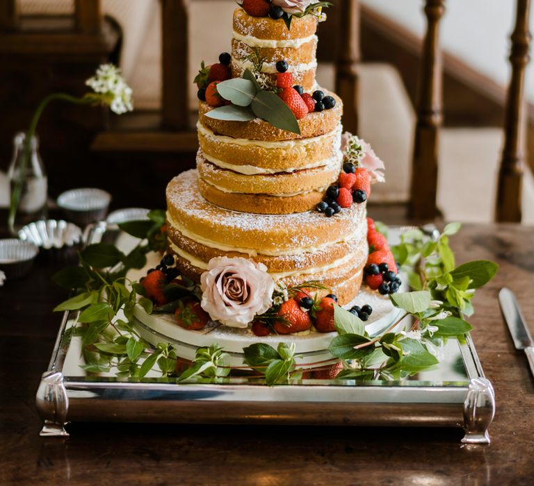 Naked Sponge Wedding Cake with Fruit Decor | Outdoor Ceremony & Rustic Barn Reception at Pennard House Somerset | John Barwood Photography