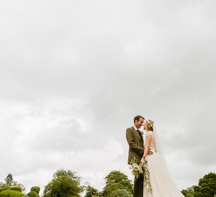 Bride in Jenny Packham Gown | Groom in Hugo Morris Tweed Suit | Outdoor Ceremony & Rustic Barn Reception at Pennard House Somerset | John Barwood Photography