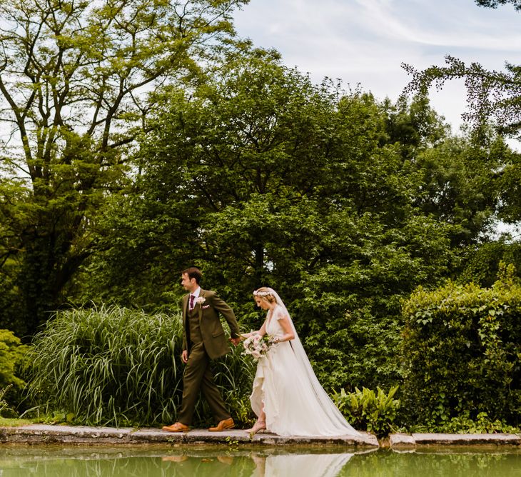 Bride in Jenny Packham Gown | Groom in Hugo Morris Tweed Suit | Outdoor Ceremony & Rustic Barn Reception at Pennard House Somerset | John Barwood Photography