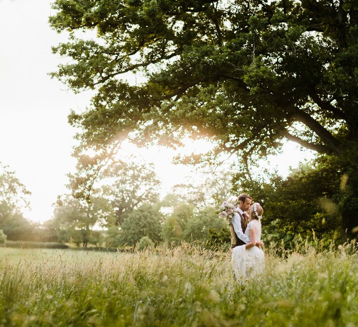 Bride in Jenny Packham Gown | Groom in Hugo Morris Tweed Suit | Outdoor Ceremony & Rustic Barn Reception at Pennard House Somerset | John Barwood Photography