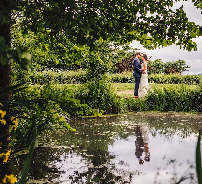 Bride in Morlee | Groom in Hugo Boss Suit | DIY At Home Marquee Wedding | J S Coates Wedding Photography