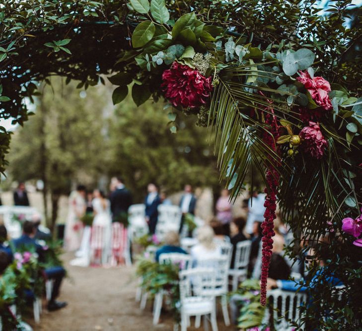 Outdoor Wedding Ceremony | Bride in Jenny Packham Dolly Bridal Gown | Tropical Green & Fuchsia Pink Wedding at Castellina de Miremont, Italy Planned & Styled by Come le Ciliegie Wedding & Events | Images by Effeanfotografie | Film by Headshot Weddings