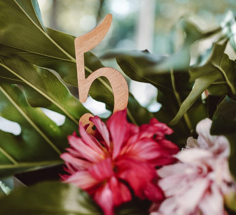 Wooden Table Number | Tropical Green & Fuchsia Pink Outdoor Wedding at Castellina de Miremont, Italy Planned & Styled by Come le Ciliegie Wedding & Events | Images by Effeanfotografie | Film by Headshot Weddings